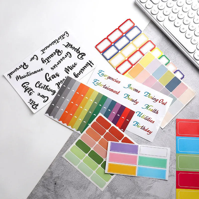 Assortment of handwritten label adhesive stickers showing A6 ruler, grid layouts, and coloured sticky notes.