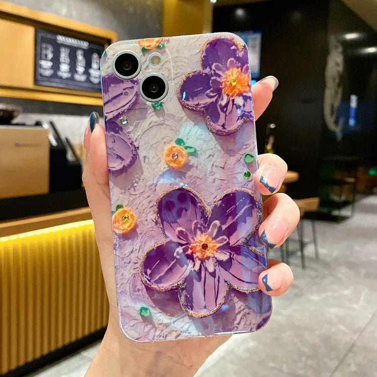 Purple and yellow soft rubber phone case with oil painting flower design and glittering diamond glue details.