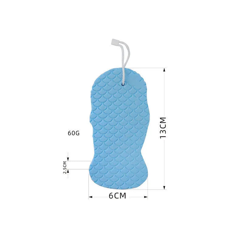 White 3D fish scale pattern bath sponge ball with hanging loop on a bathroom background.