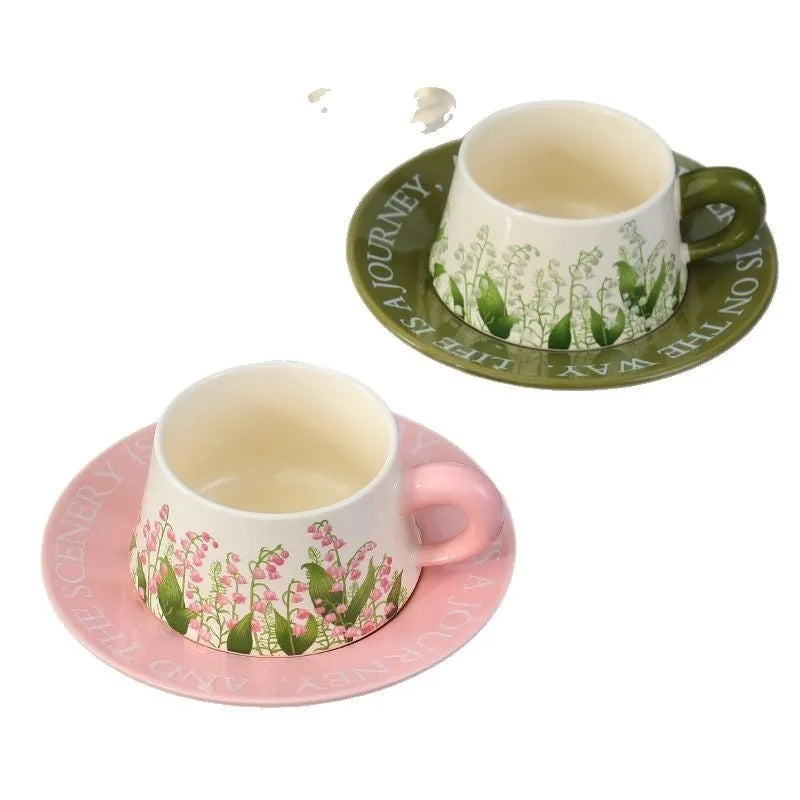 Ceramic coffee cup and saucer set with two cups, two plates, and two spoons in Campanula design