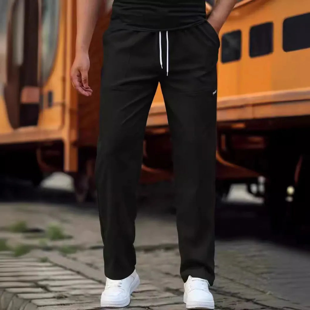 Men's light grey polyester casual trousers laid flat showing front design.