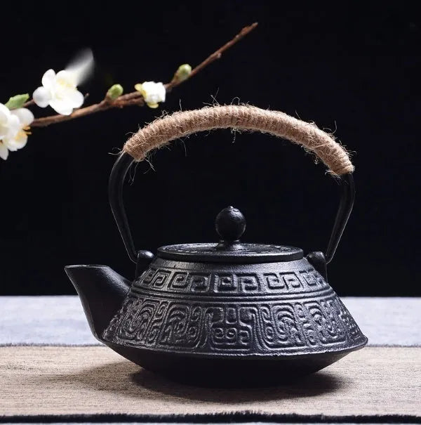 Japanese style cast iron teapot with 0.9 litre capacity shown in a bronze finish.
