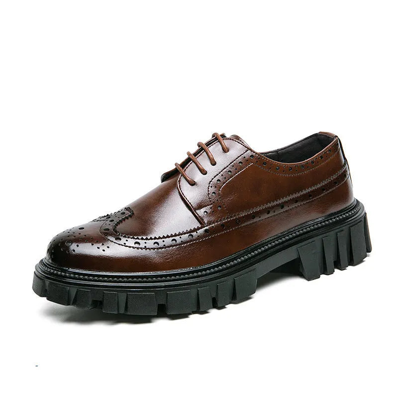 Men's black brogue leather shoes with round toe on a solid background