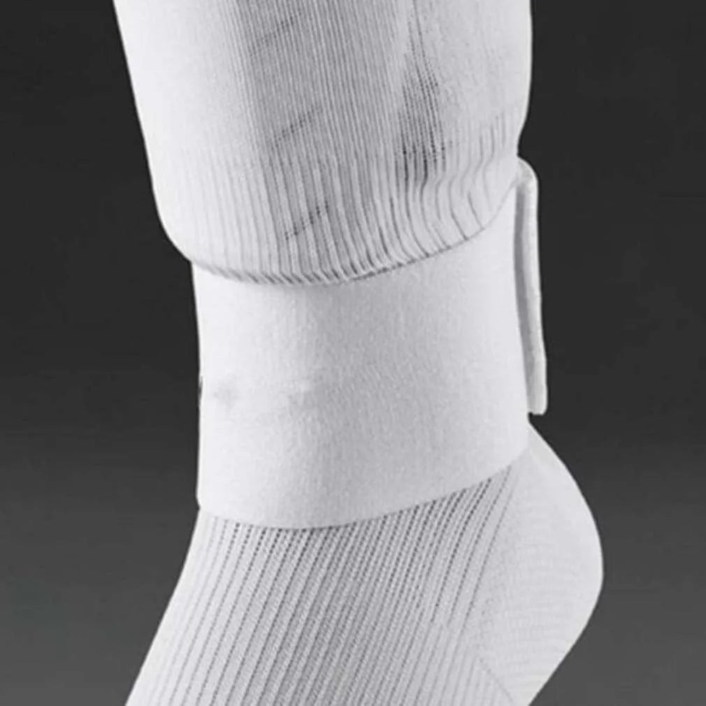 Red rubber football shin guard strap laid flat showing its 25cm length and 6.5cm width.