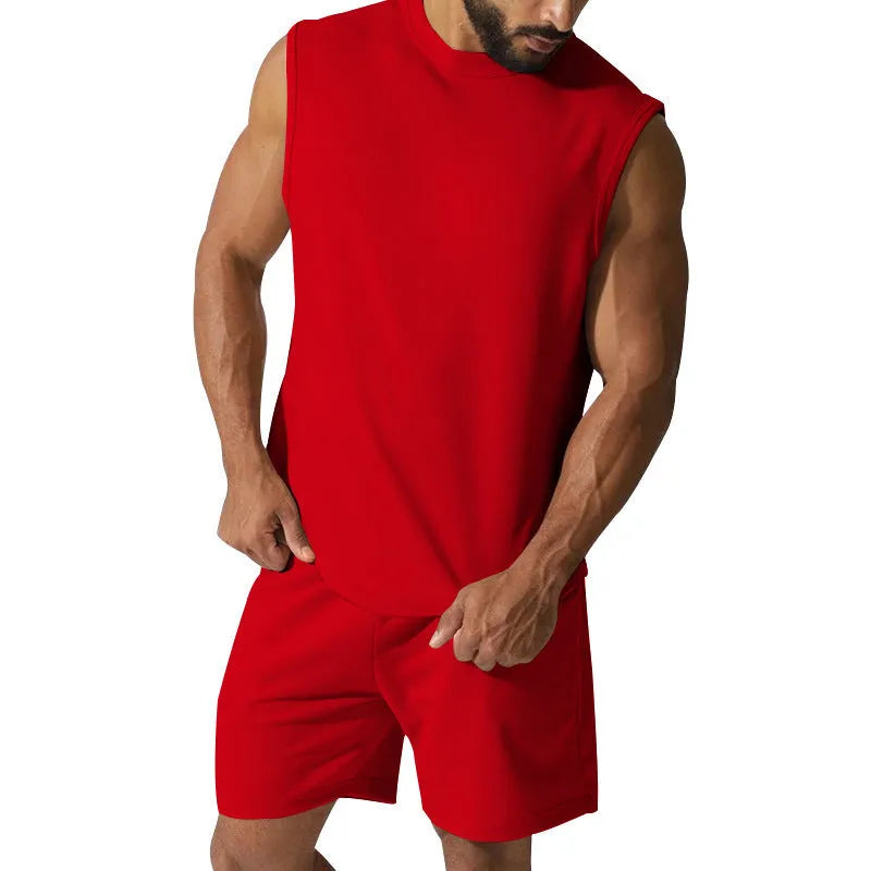 Men's sleeveless cotton blend sports suit with matching shorts in a solid colour.