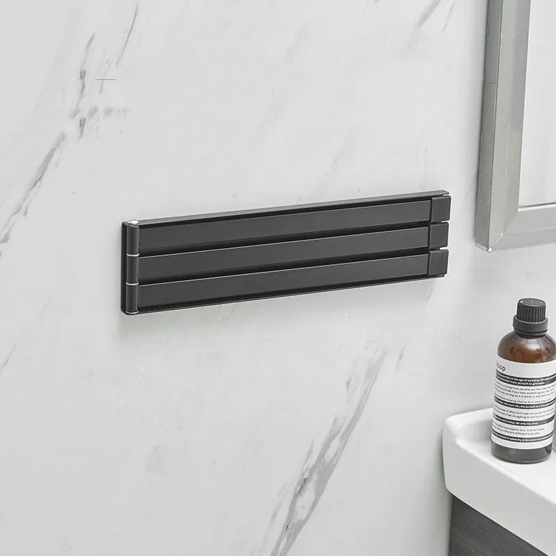 Nordic non-perforated folding towel rack in black or white for bathroom installation without drilling