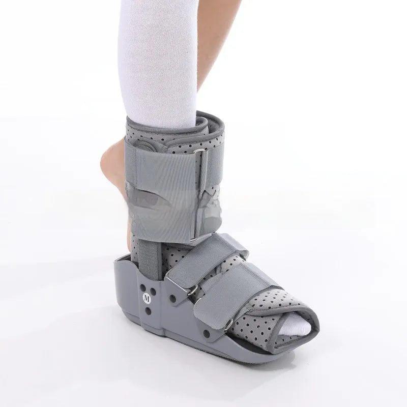 Grey Achilles tendon rehabilitation walking boot with fixed support design and adjustable sizing
