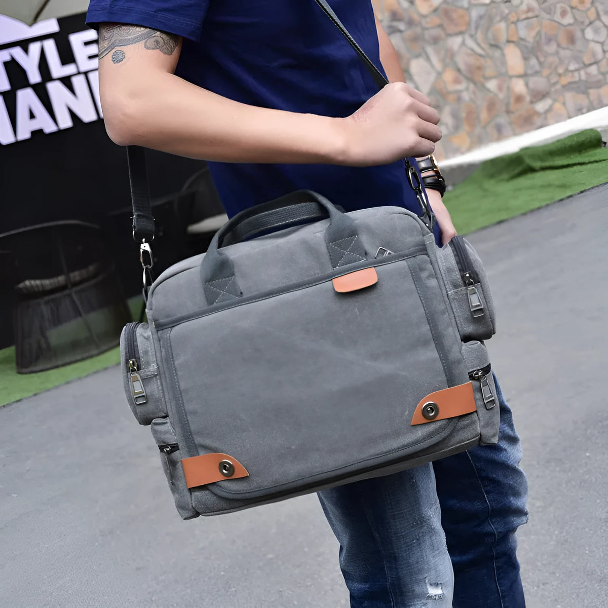 Multi-compartment canvas men's shoulder bag in khaki with horizontal square shape and zip top