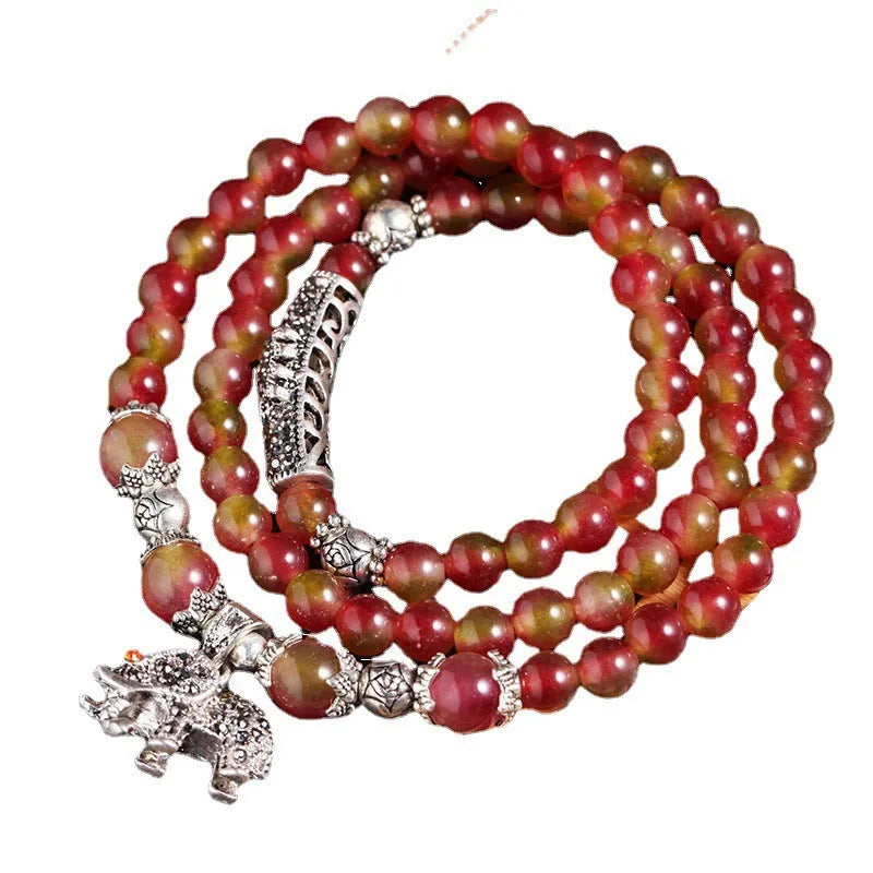 Handmade watermelon crystal Chinese knot bracelet with traditional geometric designs in 8mm and 6mm elephant style sizes