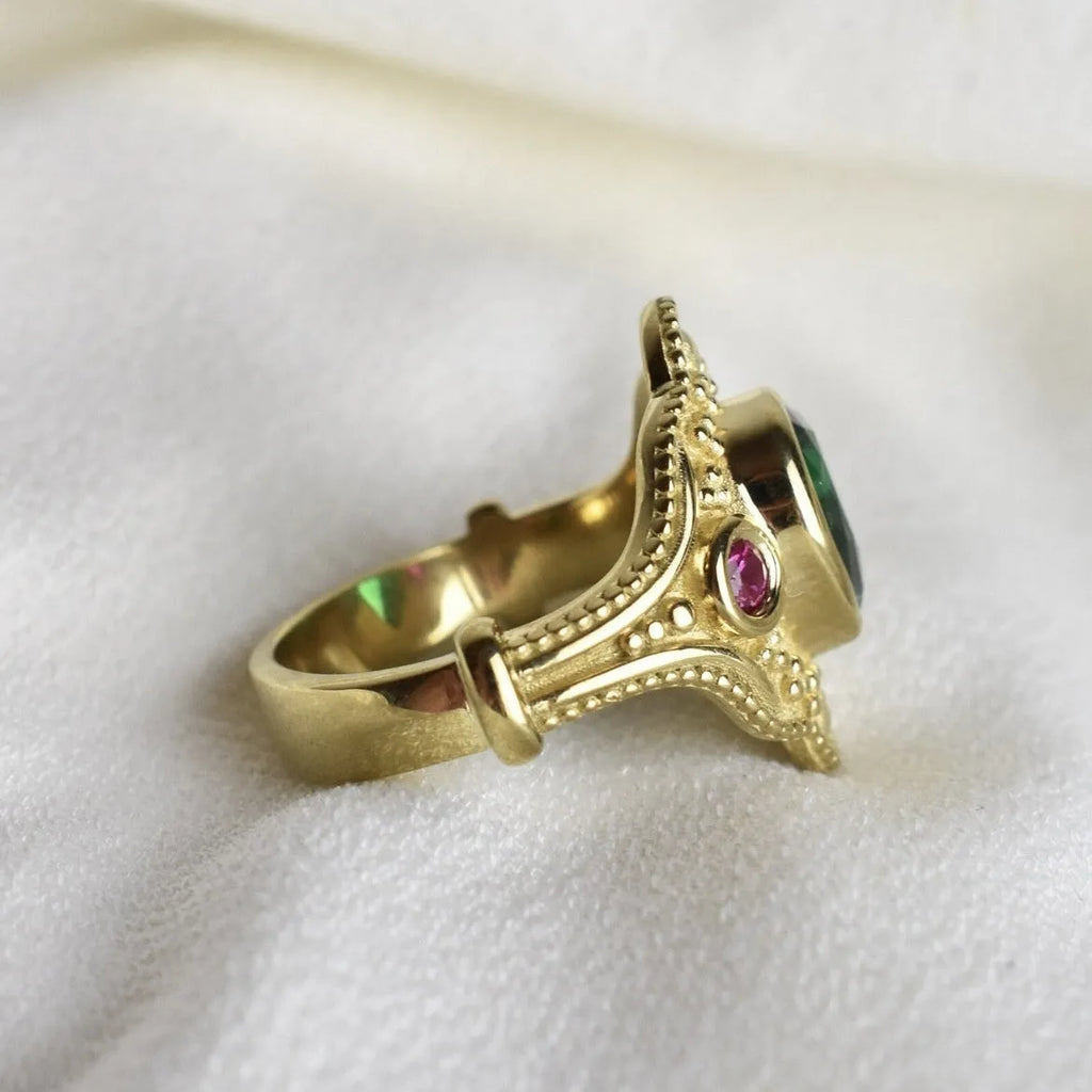 Gold-plated women's alloy ring with geometric shape and lvzuan colour on a white background.