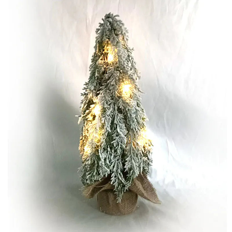 24-inch desktop artificial Christmas tree with LED lights and white snow finish on plastic branches