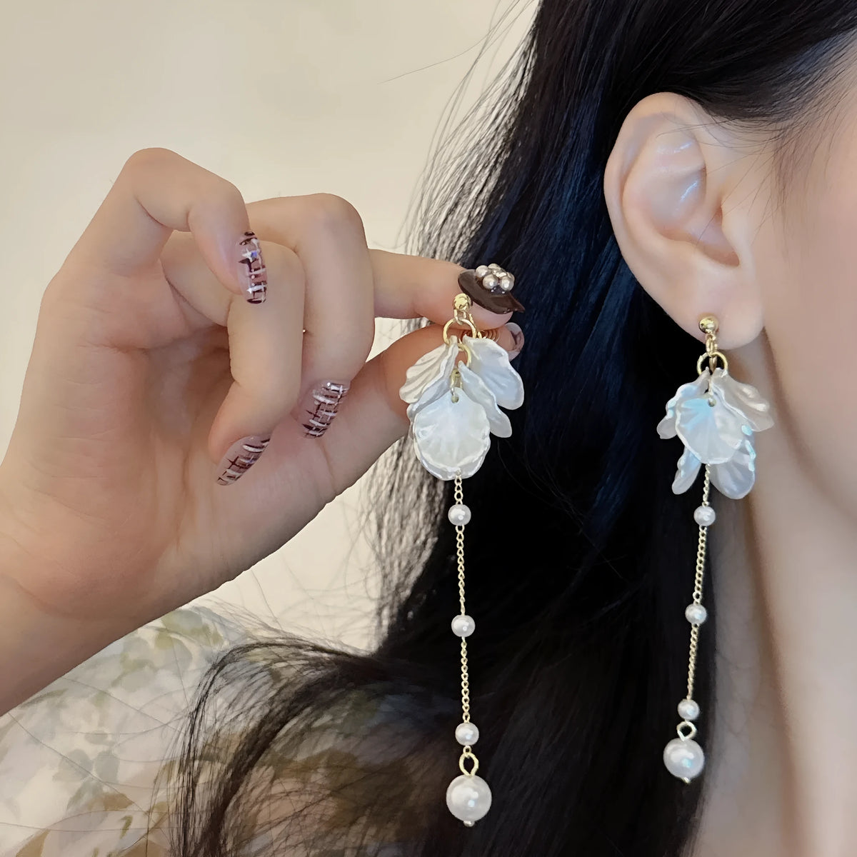 Women's acrylic shell pearl tassel earrings showing 8.8cm length and tassel design