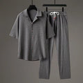 Men's Chinese-style casual two-piece set with short sleeve top and trousers, shown in available colour options.