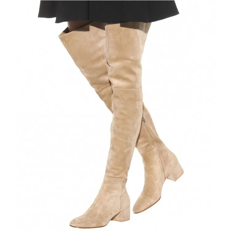 Grey women's suede over-the-knee flat boots with a pointed toe and low thick heel.