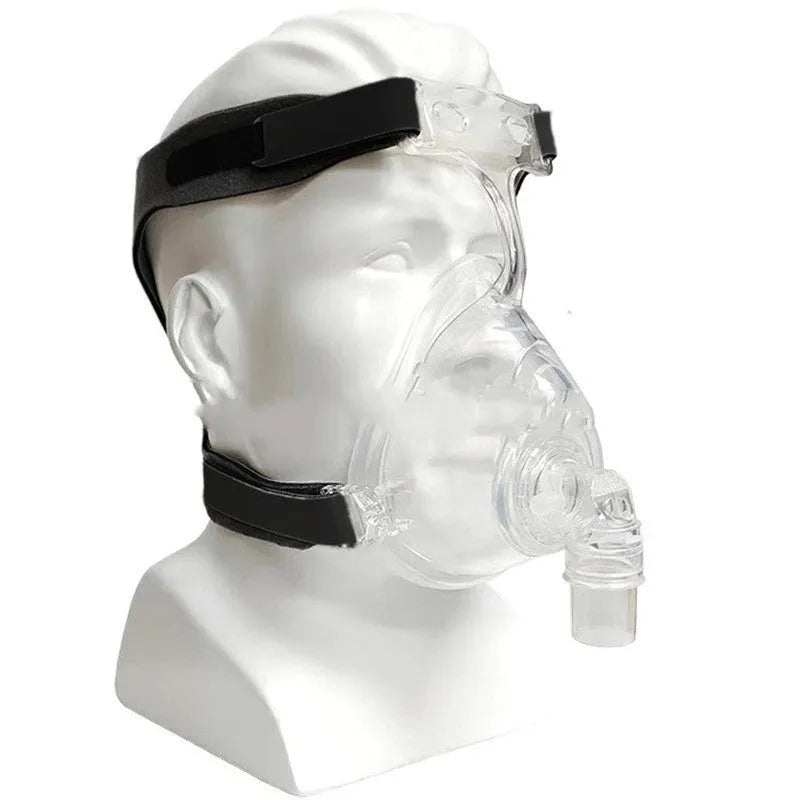 Transparent CPAP breathing mask with silicone cushion, headgear, and adapter elbows