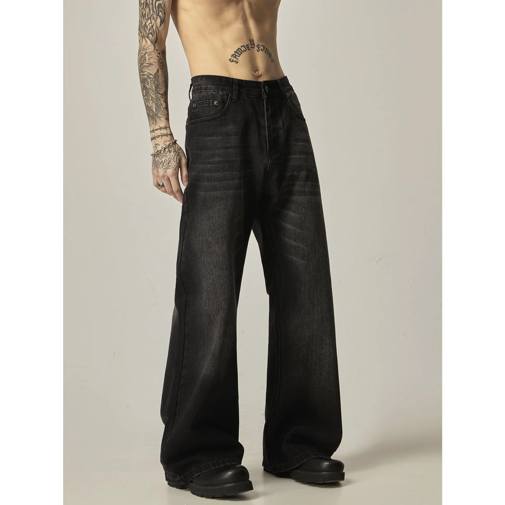 Black loose-fit straight leg denim jeans on a mannequin, showing the zip fly and retro style.