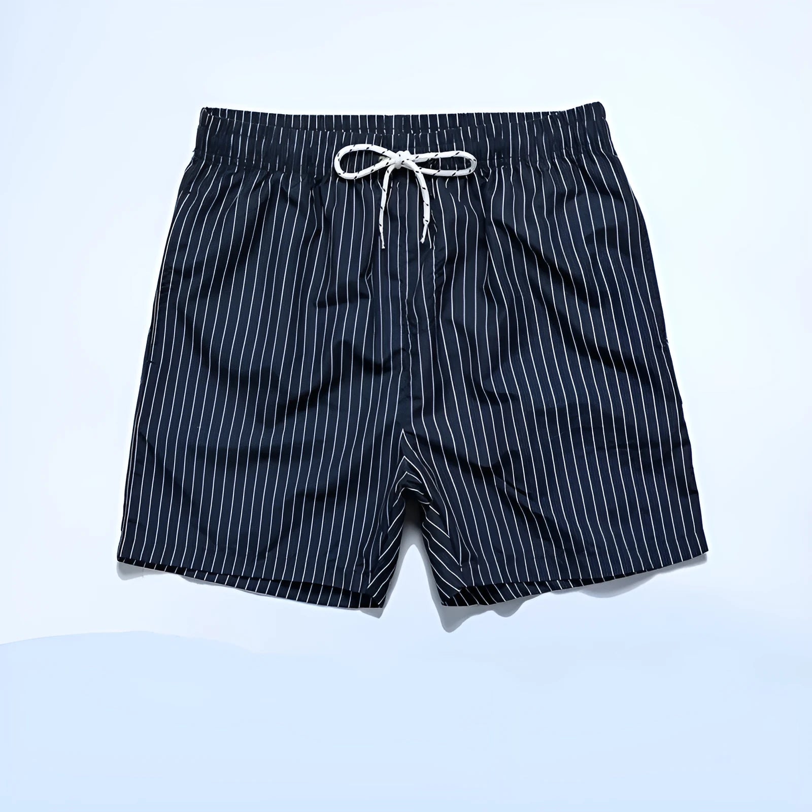 Striped polyester beach shorts in navy blue, shown with straight leg openings and triangle lining.