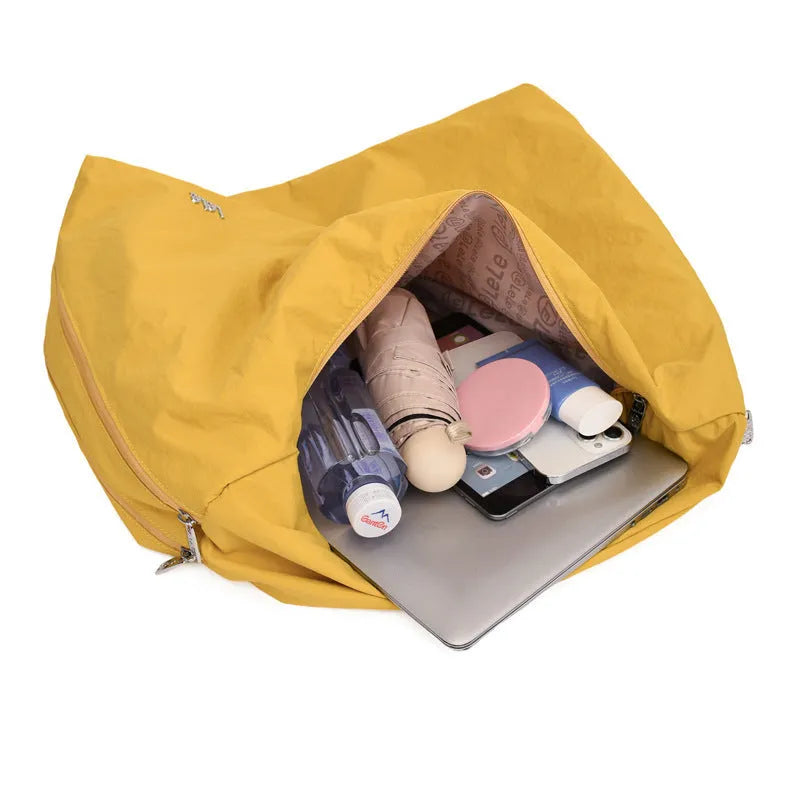 Heart-shaped nylon underarm bag for women in black, blue, khaki, and yellow colour options