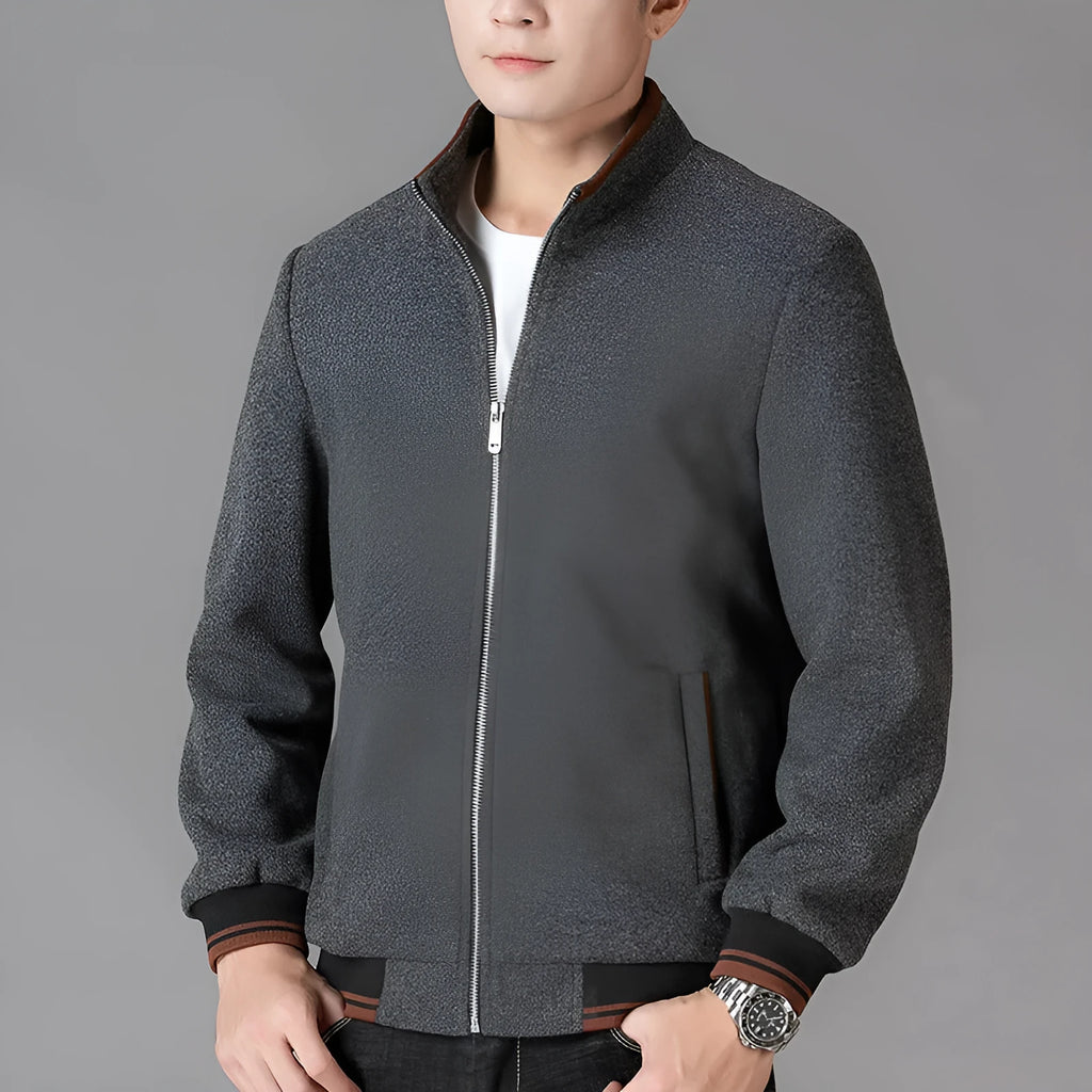 Men's grey polyester fleece jacket with zip pockets and long sleeves, shown on a hanger.
