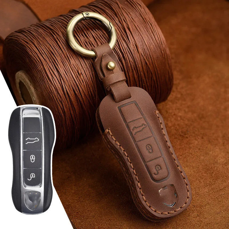Genuine cowhide leather retro-style key cover for Porsche cars, shown in blue and brown colour options.