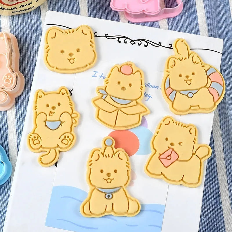 Three dimensional plastic press mould for creating puppy cartoon biscuits and cake decorations.