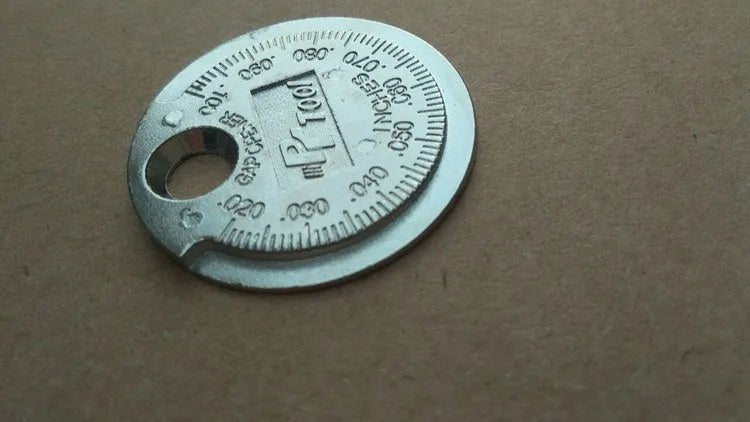 Round zinc alloy spark plug gauge with dual metric and inch scales