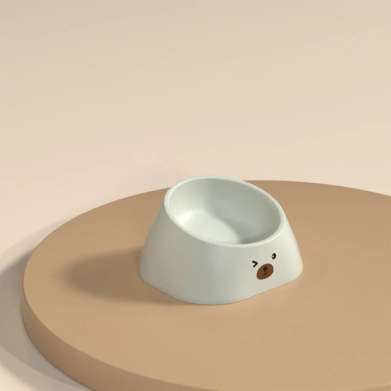 Green tilted pet bowl with 15-degree angle for cervical spine support on white background
