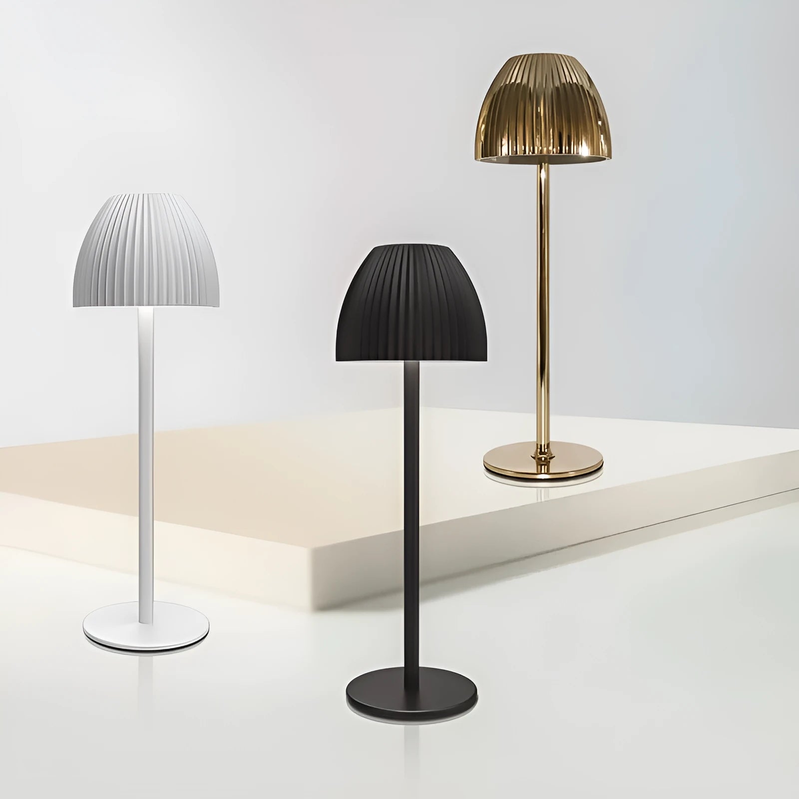 Small modern night lamp with dimming feature in black or white thin round bottom design