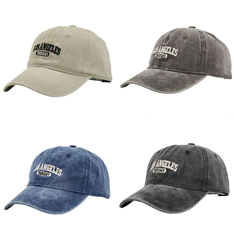 Retro-style adjustable acrylic peaked cap with embroidered letters, shown in a distressed beige colour.