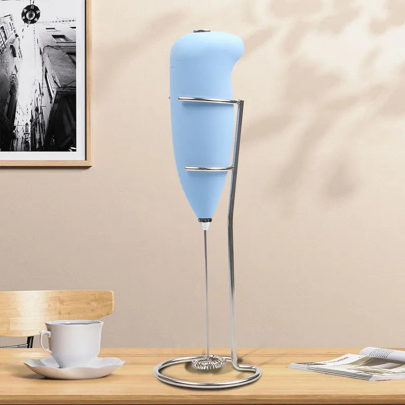 Home mini electric plastic milk frother in black on white background, 5x3x21cm