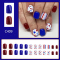 Short glossy false nails with strawberry and cherry patterns in red and blue colour combinations