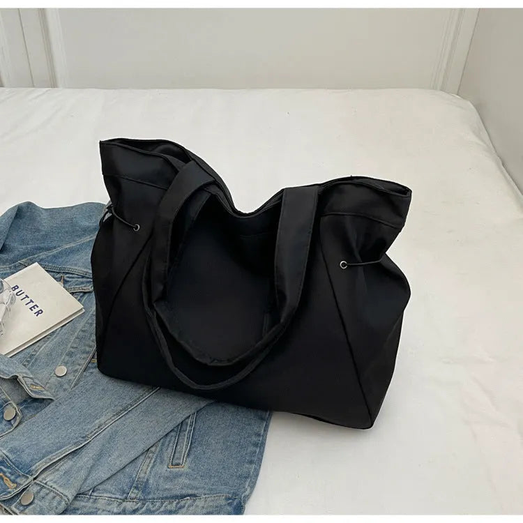 Soft Oxford cloth folding tote bag shown in multiple colours: black, brown, grey, and purple.