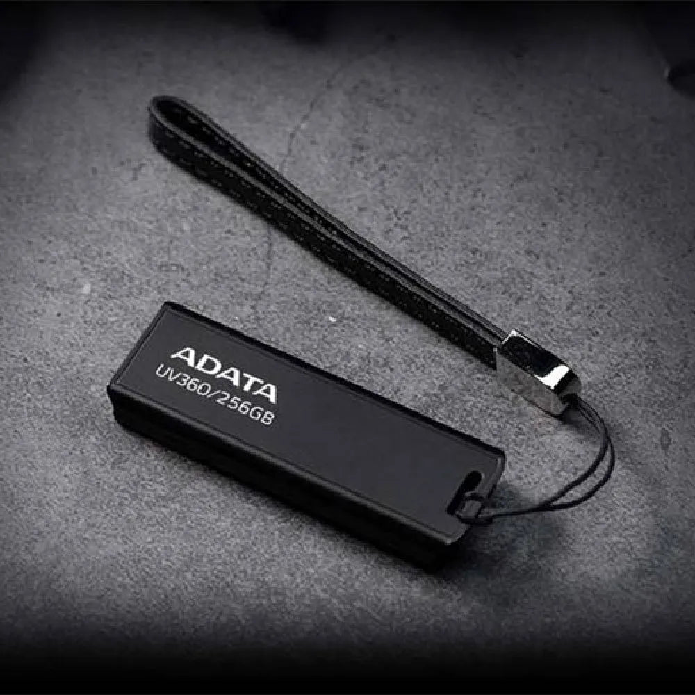 Black car-mounted USB flash drive with waterproof flex plastic case showing USB 3.2 connector.