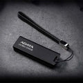 Black car-mounted USB flash drive with waterproof flex plastic case showing USB 3.2 connector.