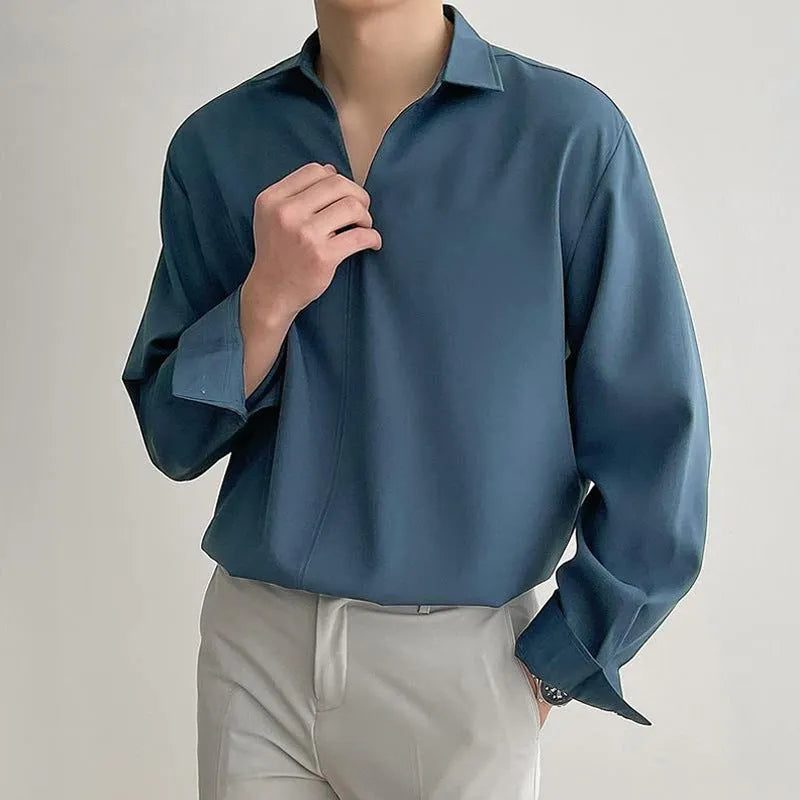 Men's loose lapel casual long sleeve shirt in a solid colour on a hanger