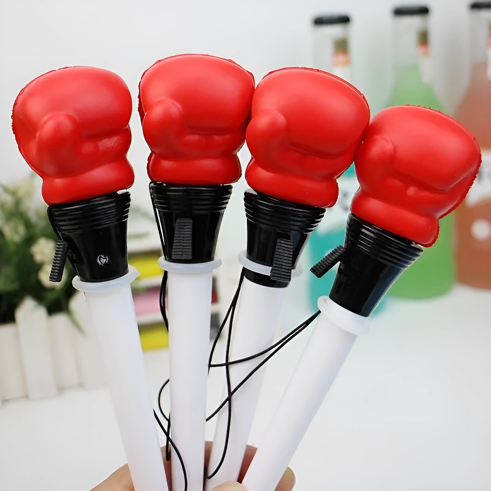 Four pressure relief boxing press ejection pens with 0.7mm bullet tips and black ink refills