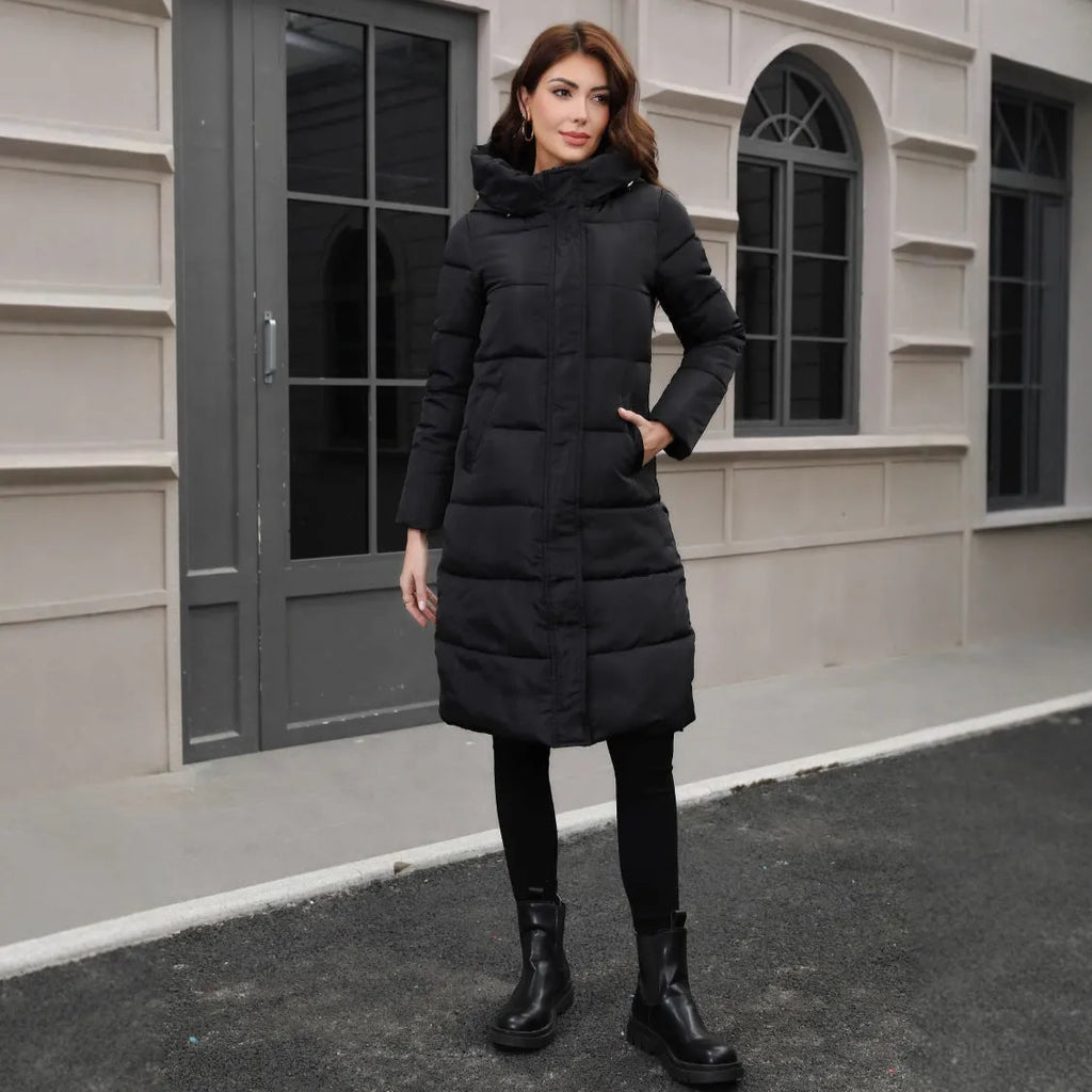 Black slim fit hooded long jacket on a model, showing tapered silhouette and regular sleeves
