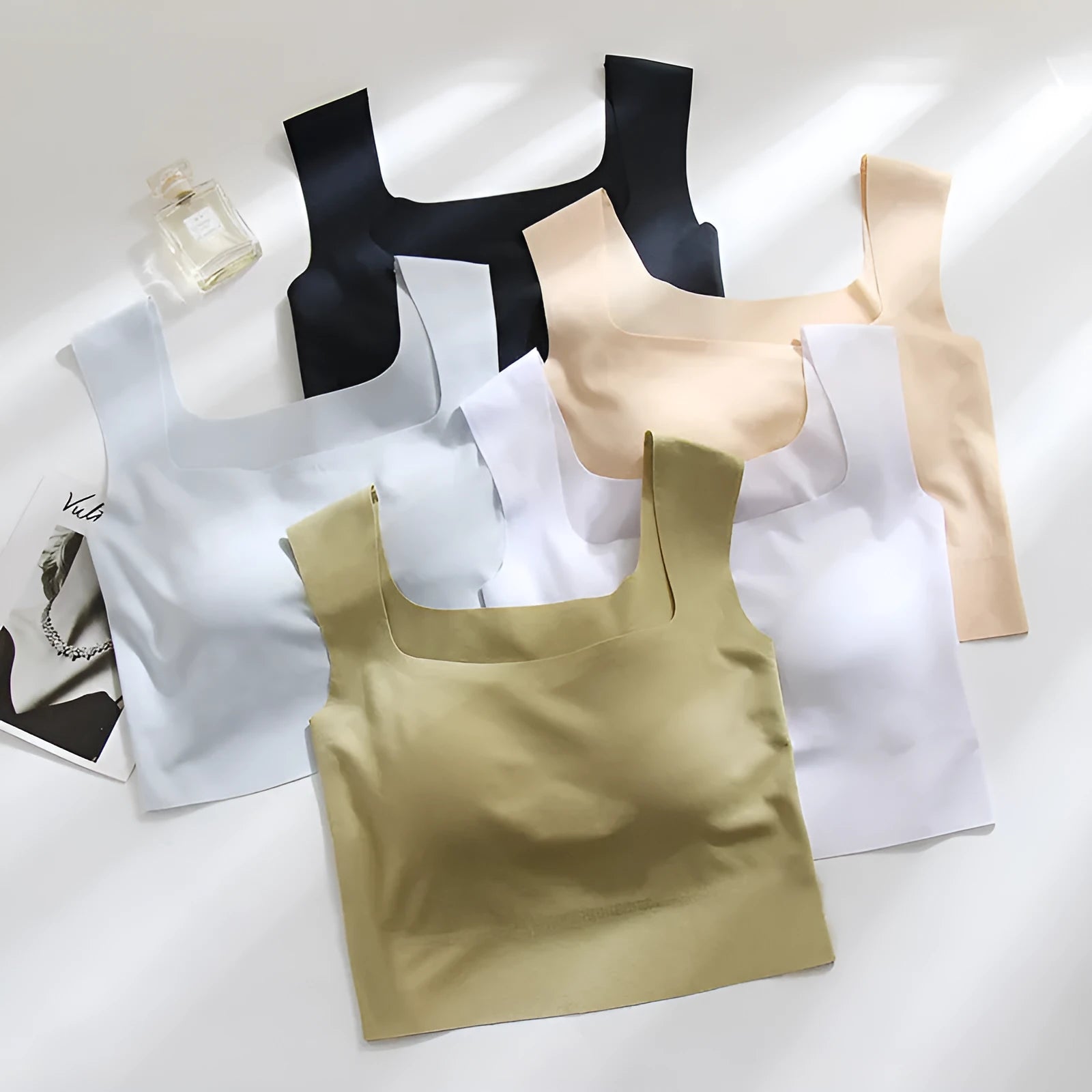 Women's non-marking seamless nylon sling vest with chest pad in light blue, shown from the back.