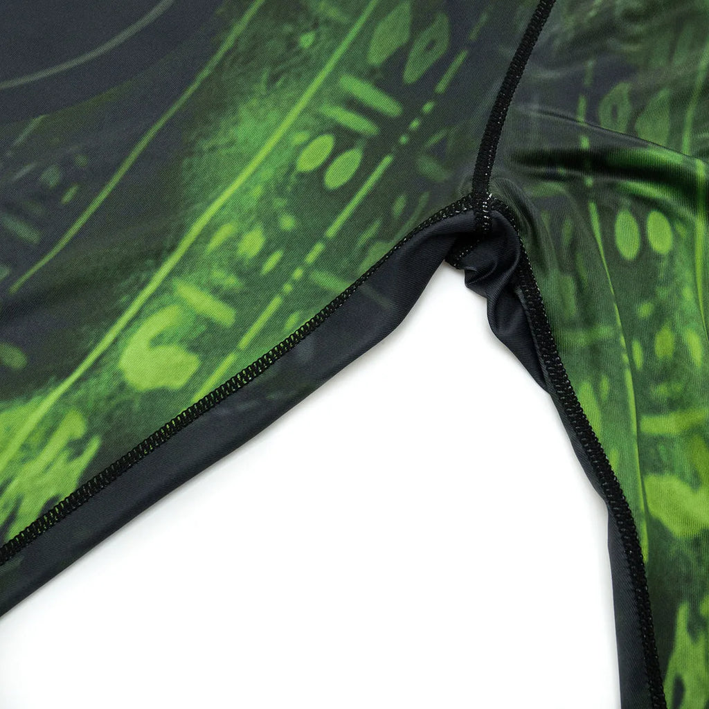 Man wearing a slim-fit, long-sleeve printed sports suit for running or fitness exercise.