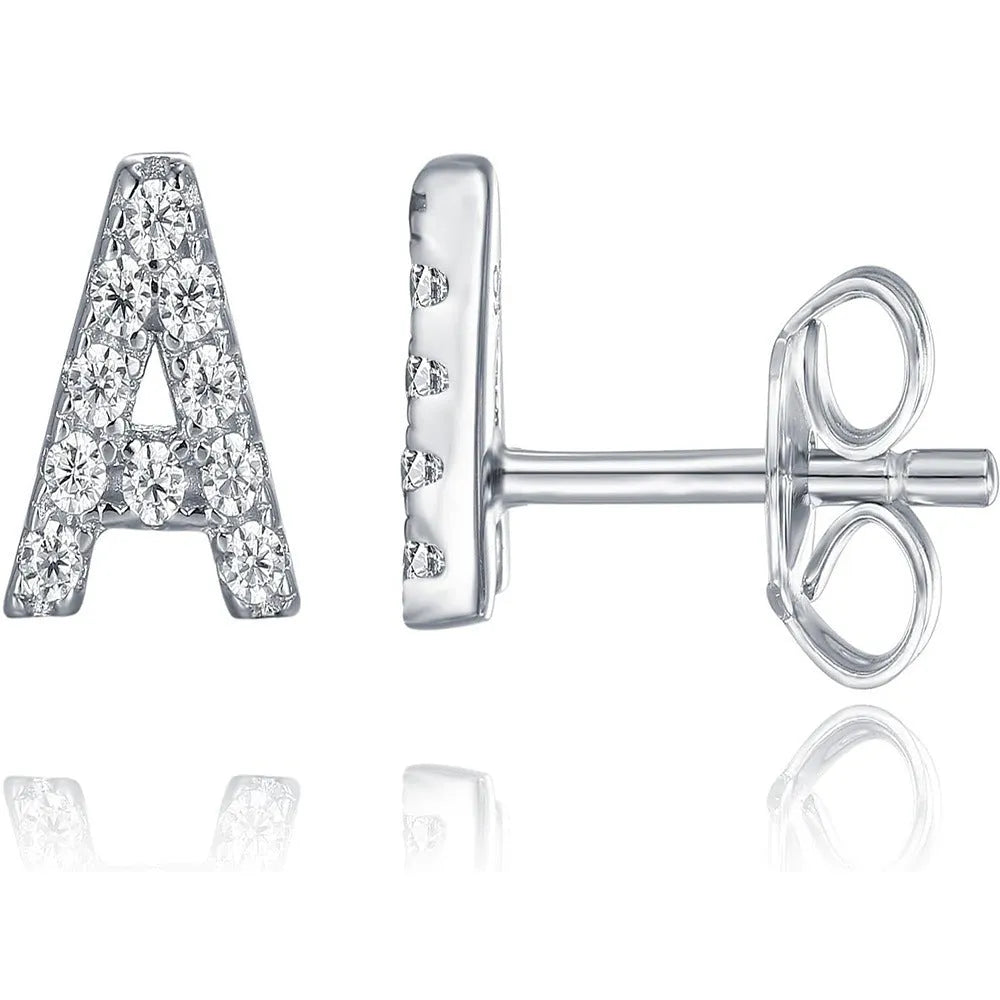 Gold plated brass alphabet letter earrings on a white background, showing zircon detail.