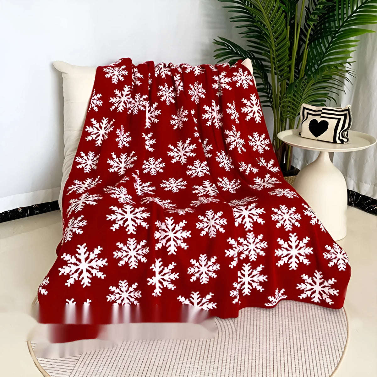 Personalised Christmas blanket with cartoon reindeer pattern, folded to show its soft acrylic texture.