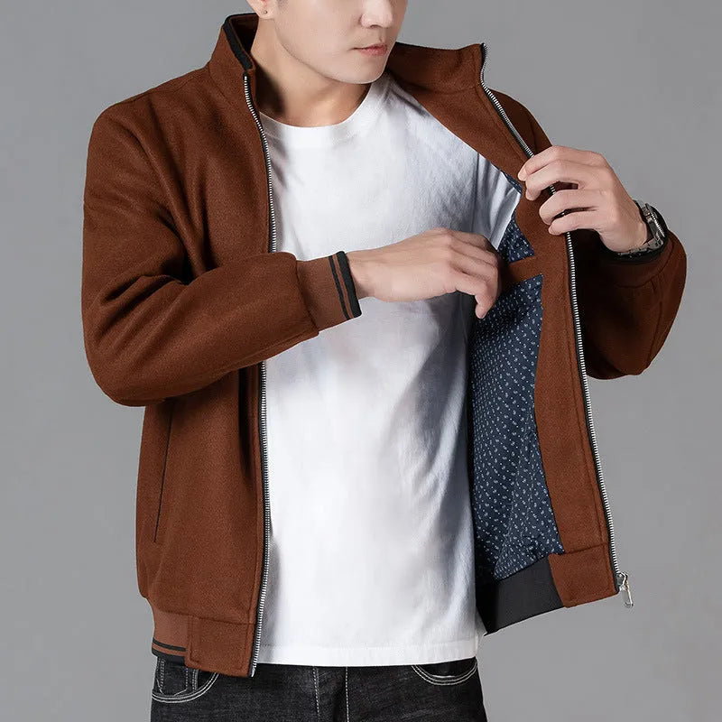 Men's grey polyester fleece jacket with zip pockets and long sleeves, shown on a hanger.