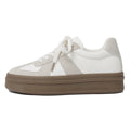Retro-style beige casual board shoes with cross straps and round toe on a rubber sole.