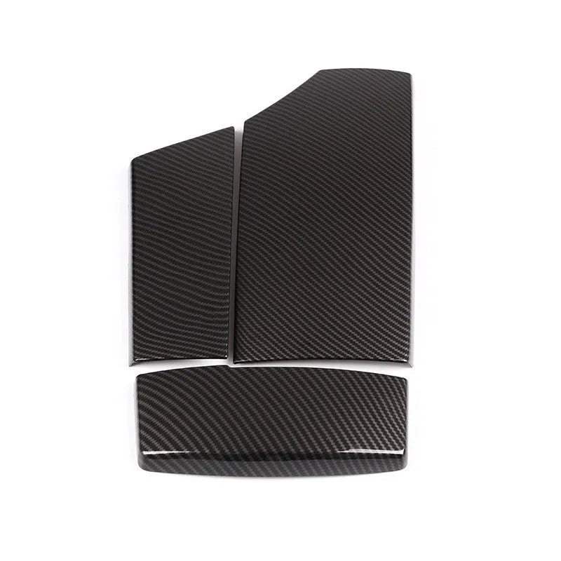 Black ABS carbon fibre pattern armrest protective cover set for car centre console, three pieces shown.