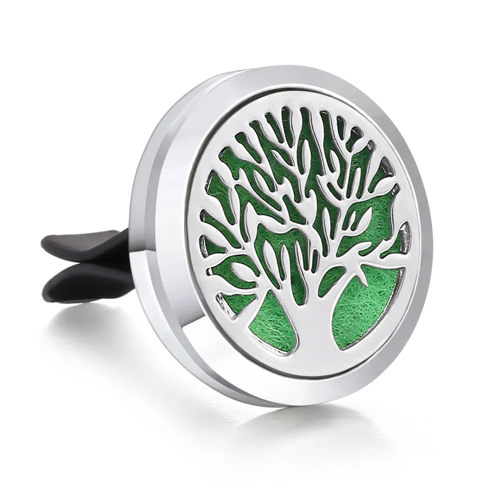 Round stainless steel car air vent perfume clip with polished finish, 30mm diameter, available in eleven steel colours and three patterns.