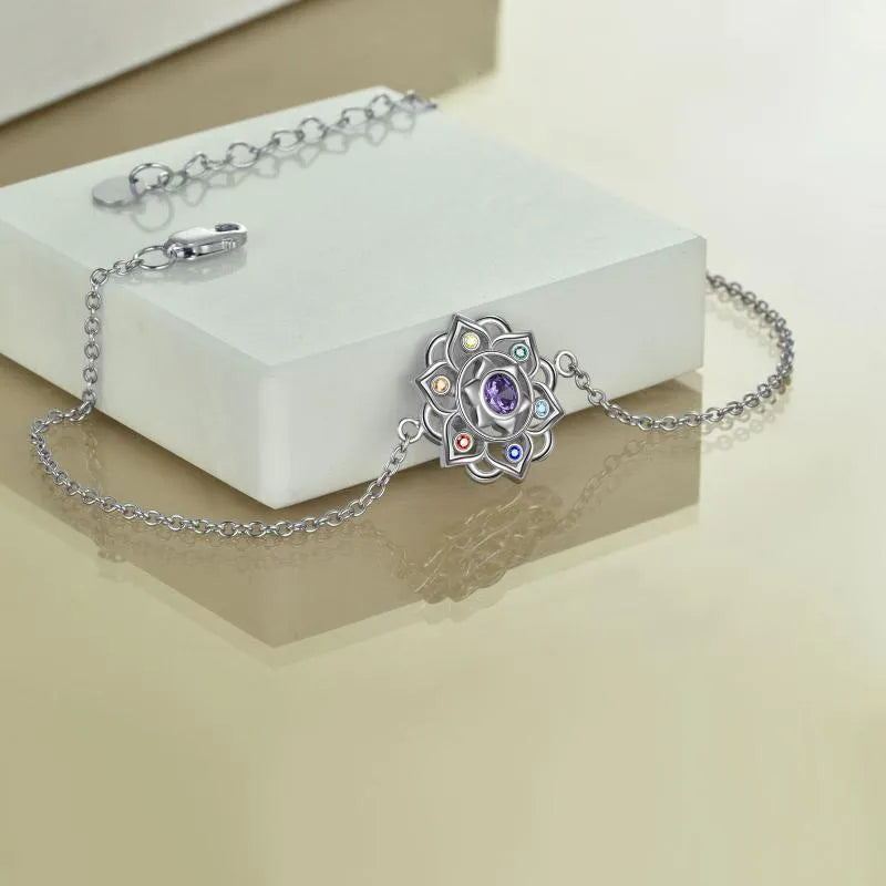 Seven chakra lotus pendant bracelet in sterling silver with white gold plated finish and adjustable cable chain
