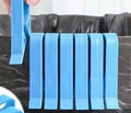 A white PP plastic garbage bag fixing clip designed to secure bin liners to rubbish cans.