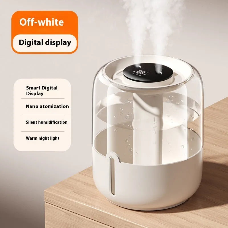 Beige round USB humidifier with dual spray outlets, humidity display, and night light on a table.