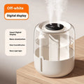 Beige round USB humidifier with dual spray outlets, humidity display, and night light on a table.