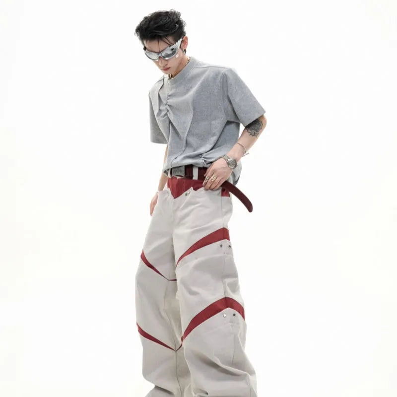 Men's grey loose-fit cotton t-shirt with three-dimensional pleats and a round neck.